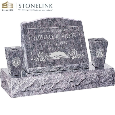 Granite slant headstone with vases